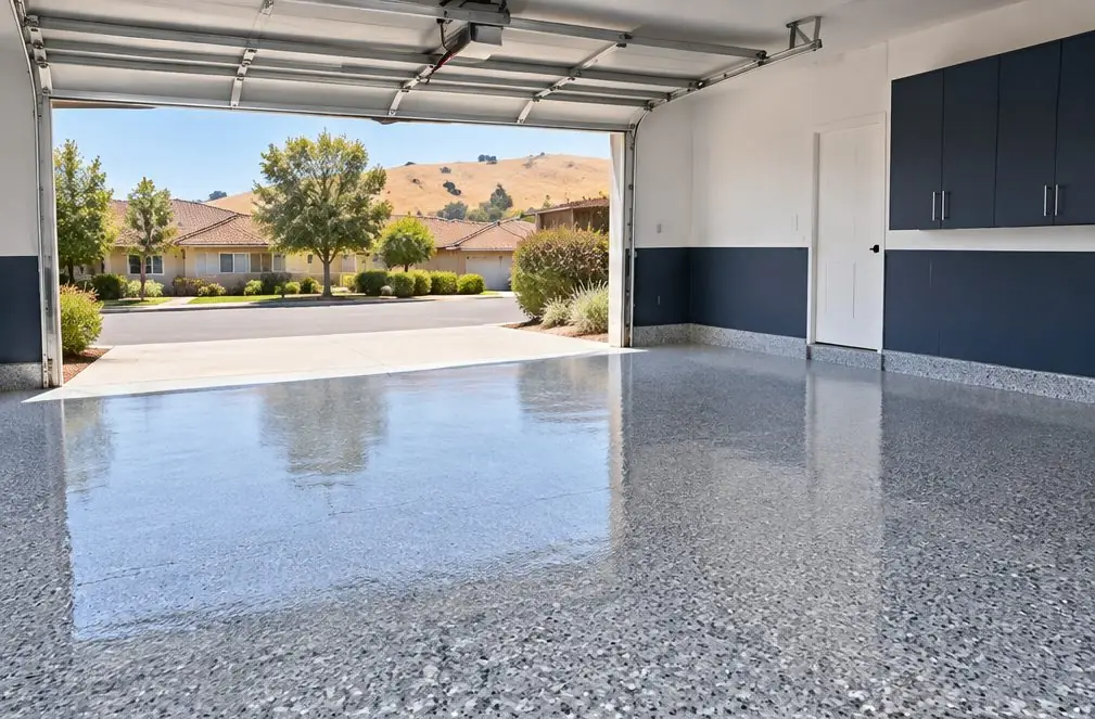 Illustration: a tidy two-car garage with a gray flake floor under a clear glossy coat and an open door to afternoon sun