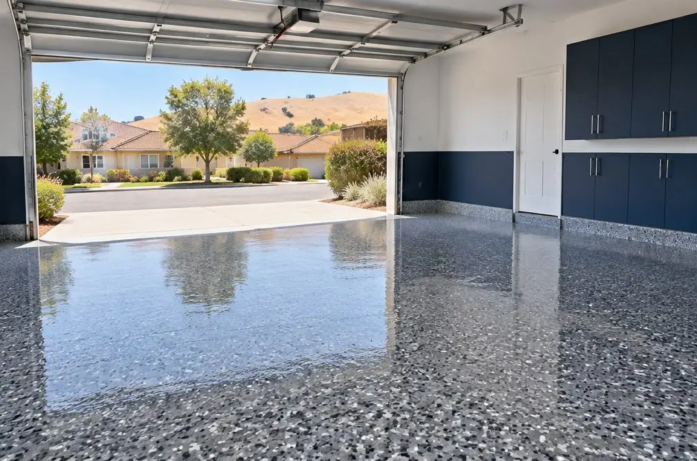 Illustration: the same garage floor finished in a gray and charcoal flake system with a glossy clear coat